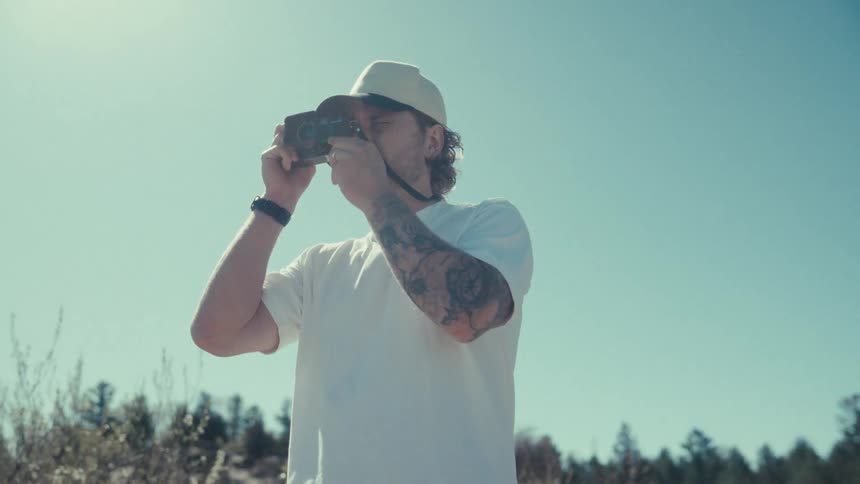A clip of a man taking a photograph
