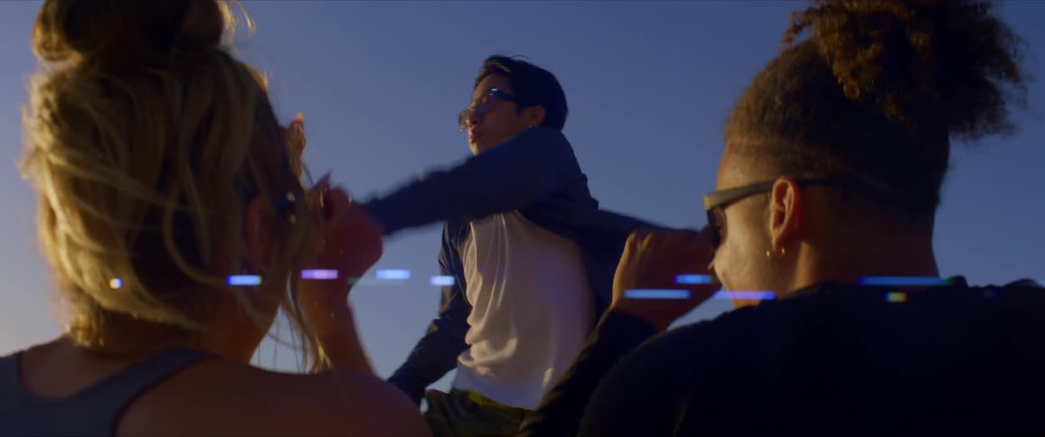Friends cheer on another friend dancing