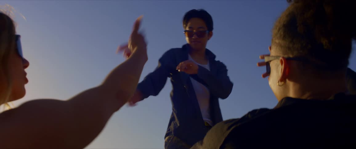 Friends dance on a sunny day