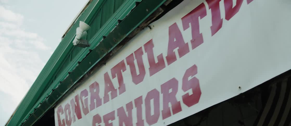 A banner with the text congratulations seniors in red letters