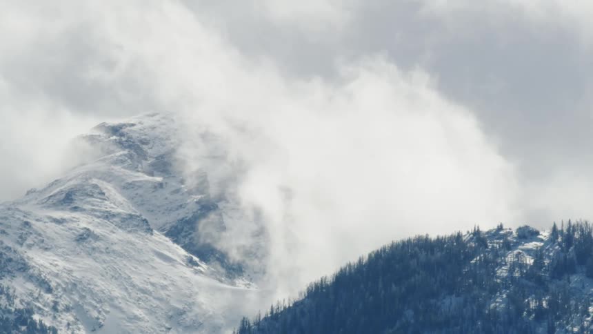 Clouds rise above mountains