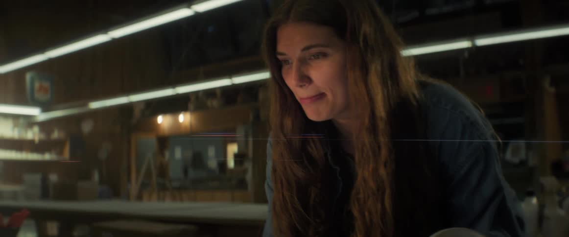 Portrait of a smiling woman using a laptop