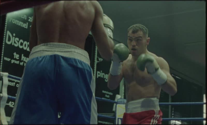 Two boxers fighting in a ring