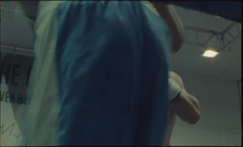 Two men are boxing in the ring