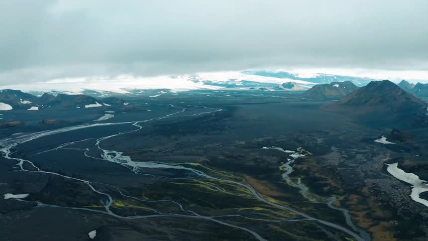 Aerial panorama of mountains and rivers during a cloudy day