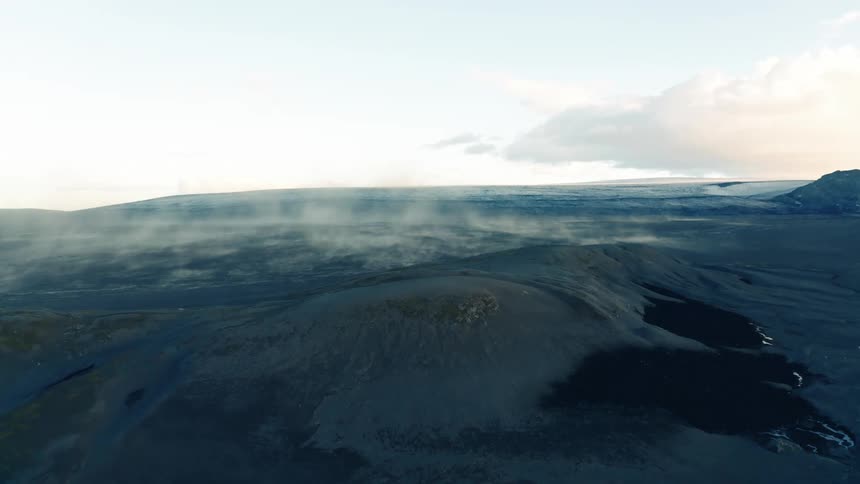 Steam rises from a large plain