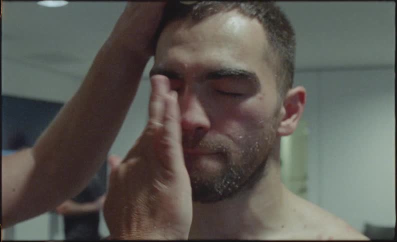 Vaseline being smeared on a mans nose