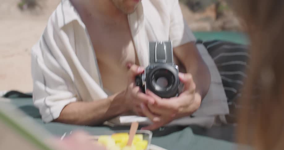 A man is photographing on the beach