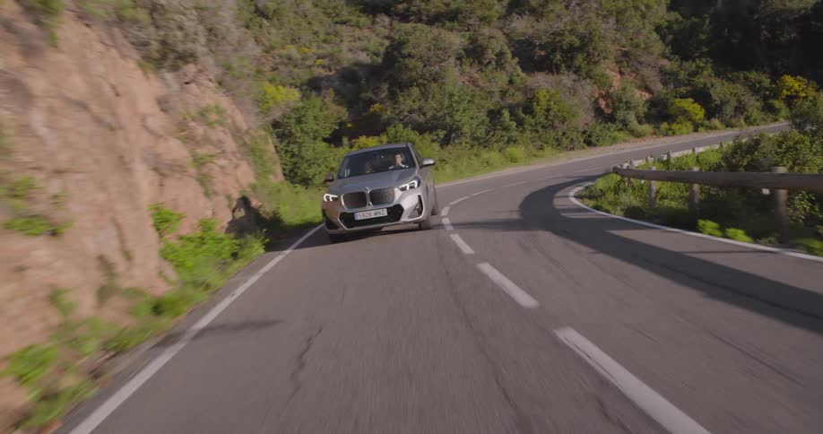 A car is turning on the winding road