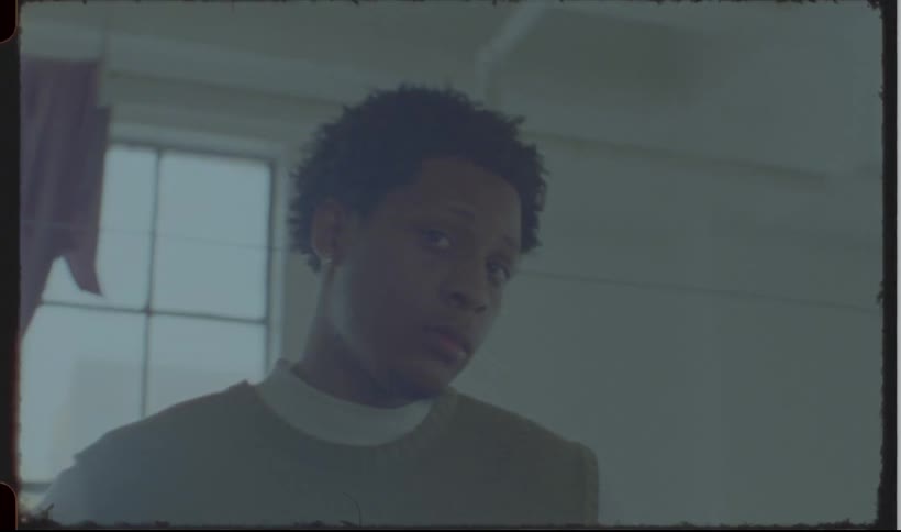 A man is standing by a window in the room