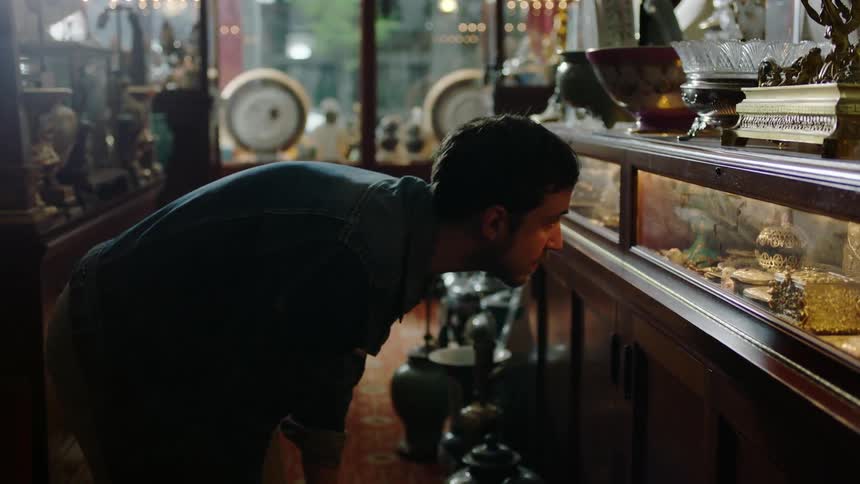 A man walks through a vintage shop