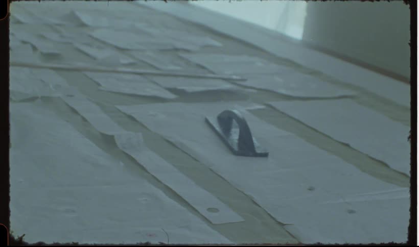 Hand taking a blue insert and placing it on top of a white paper on a civil engineering table