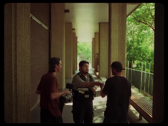 A security guard dismisses a couple of teenagers