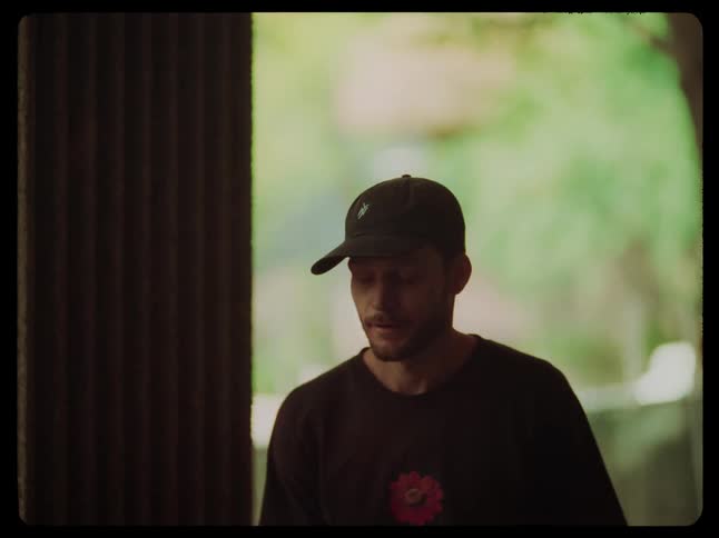 Two people walking indoors in daylight