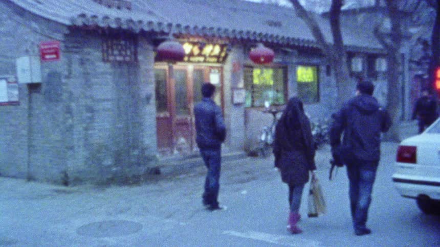 Pedestrians walking on a street in an asian village