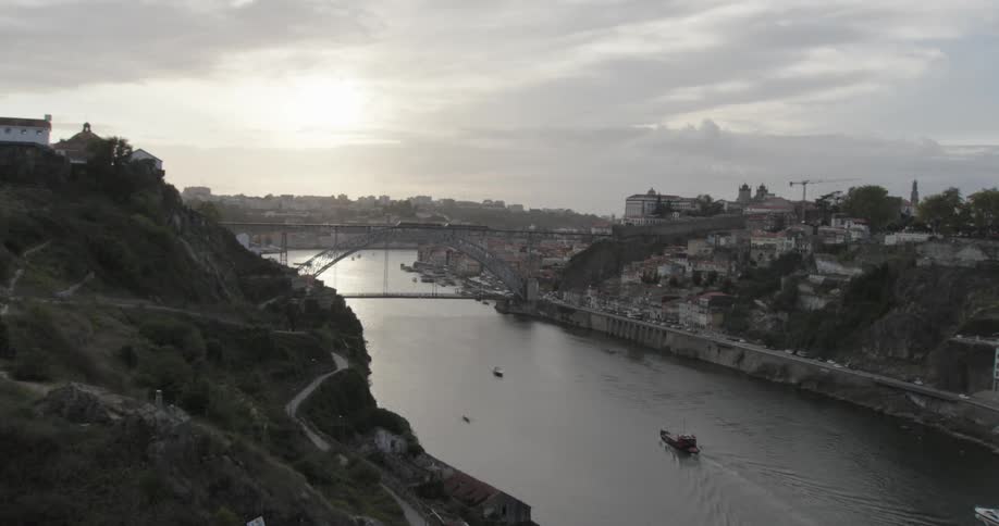 The lus i bridge a doubledecker metal arch bridge majestically spans the douro river in porto portugal