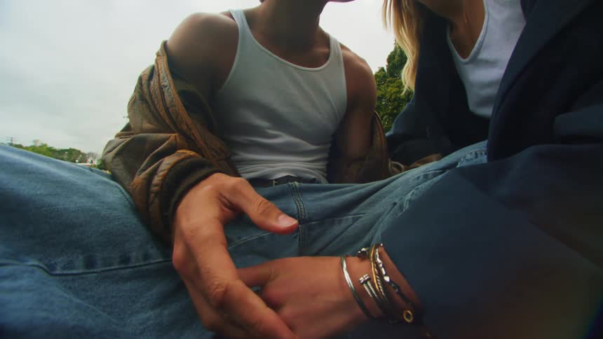 Couple sitting and holding hands romantically