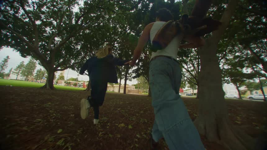 A clip of a couple running in a park