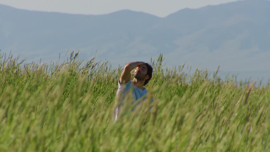 Natural environment on a hill and a man dancing