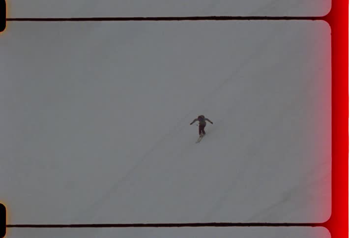 People jumping a mountain while snow skiing