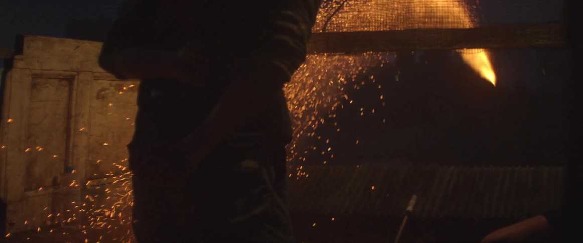 Man lighting fireworks and them shooting off