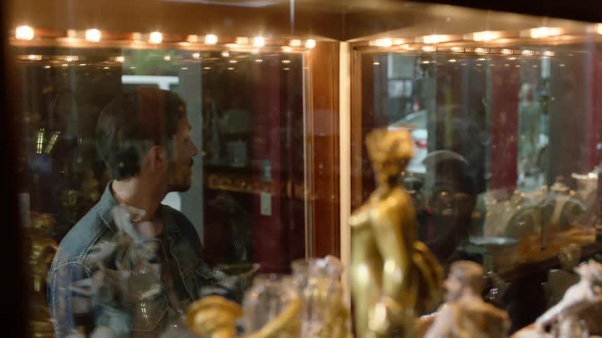 Man browsing in a curio shop