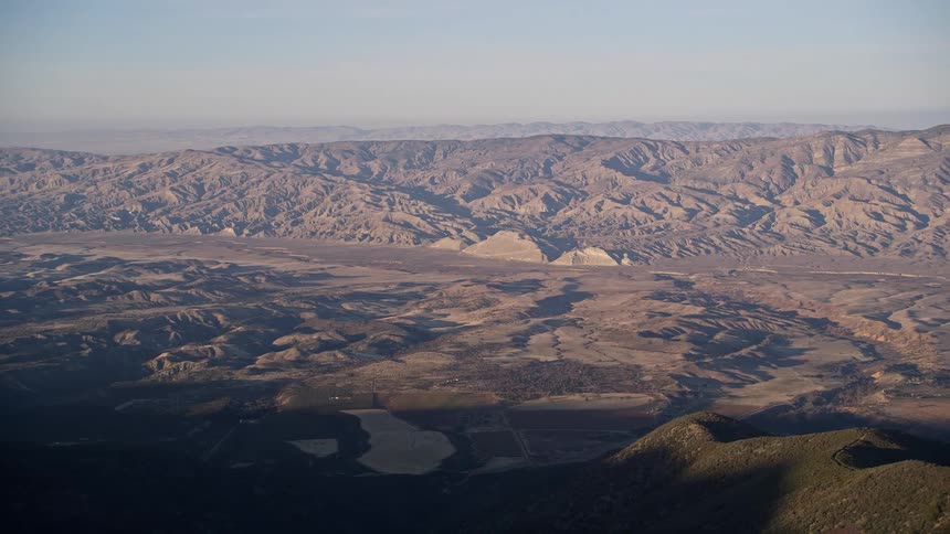 Aerial panorama of a mountain valley against a morning sky