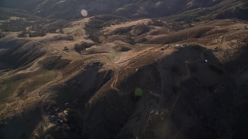 An aerial view of a rural landscape filled with hills