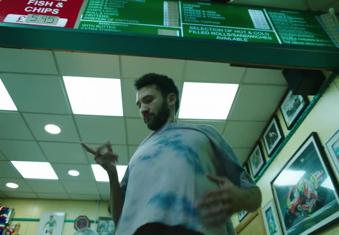 A man performs bizarre dance moves in a restaurant
