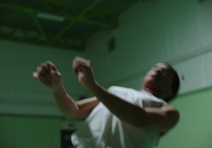 Man on a basketball court dancing