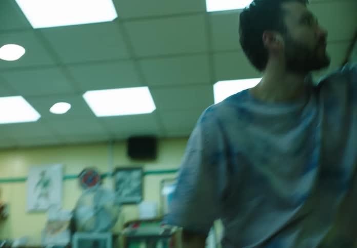 Man inside an indoor space dancing