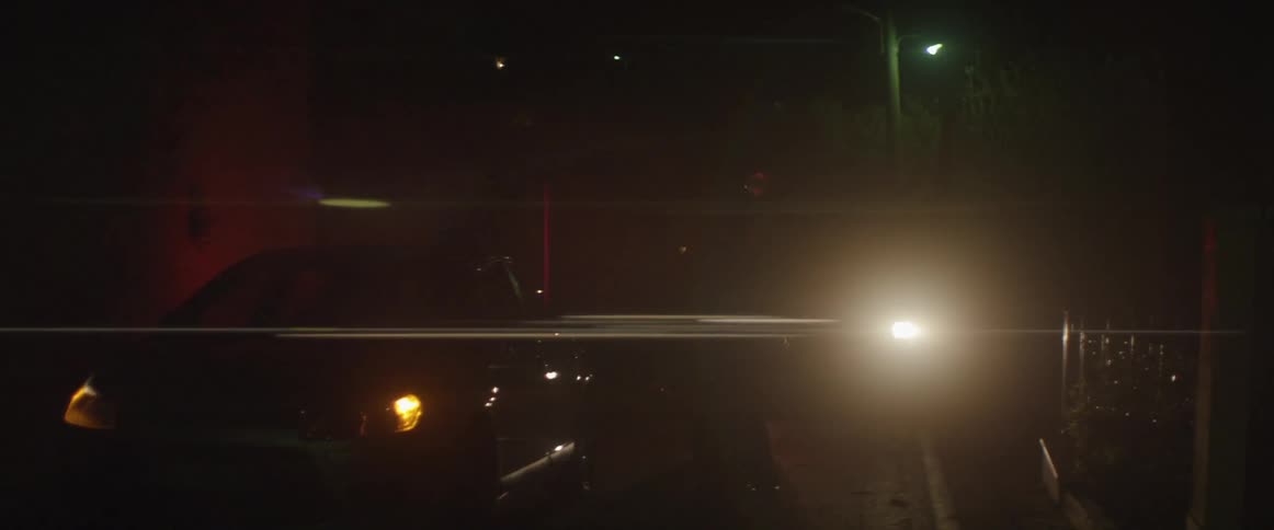 Car lights flash at night