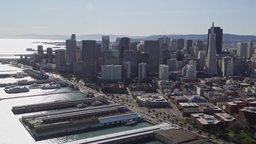 Panorama of a city with modern skyscrapers and seaside