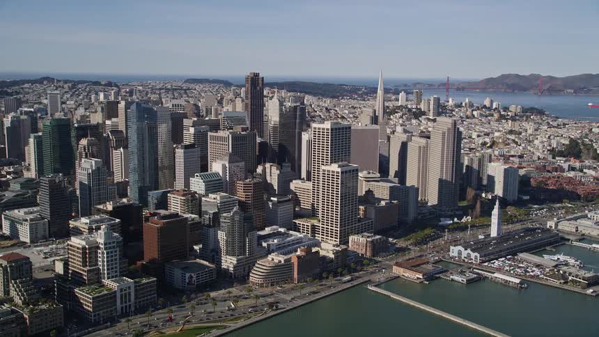 Aerial panorama of a metropolis with skyscraper on a seaside peninsula