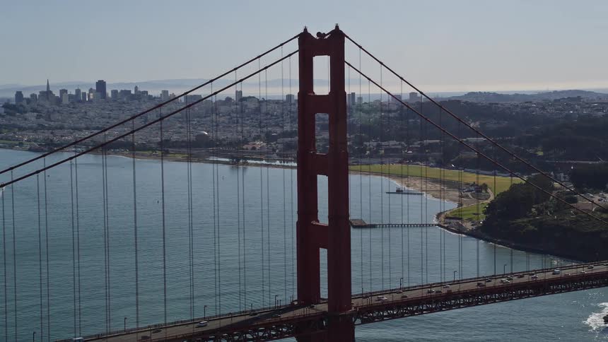 An aerial view of the golden gate bridge with the san francisco city skyline in the background