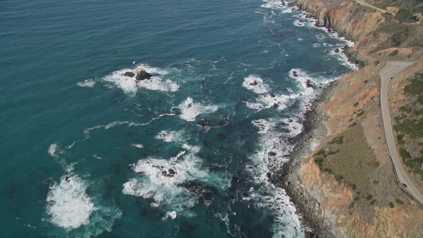 Aerial and natural view of the rocky coast on the edge of a vast sea