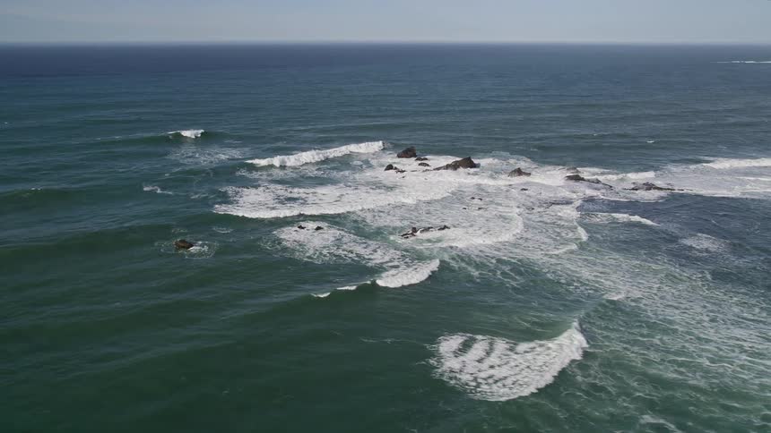 Aerial landscape of waves in the vast ocean at the shore