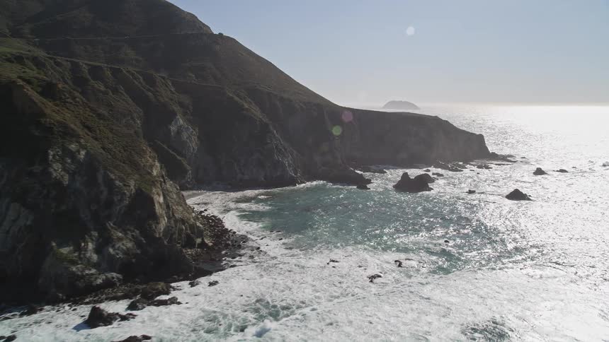 Rocky peninsula surrounded by a vast blue sea