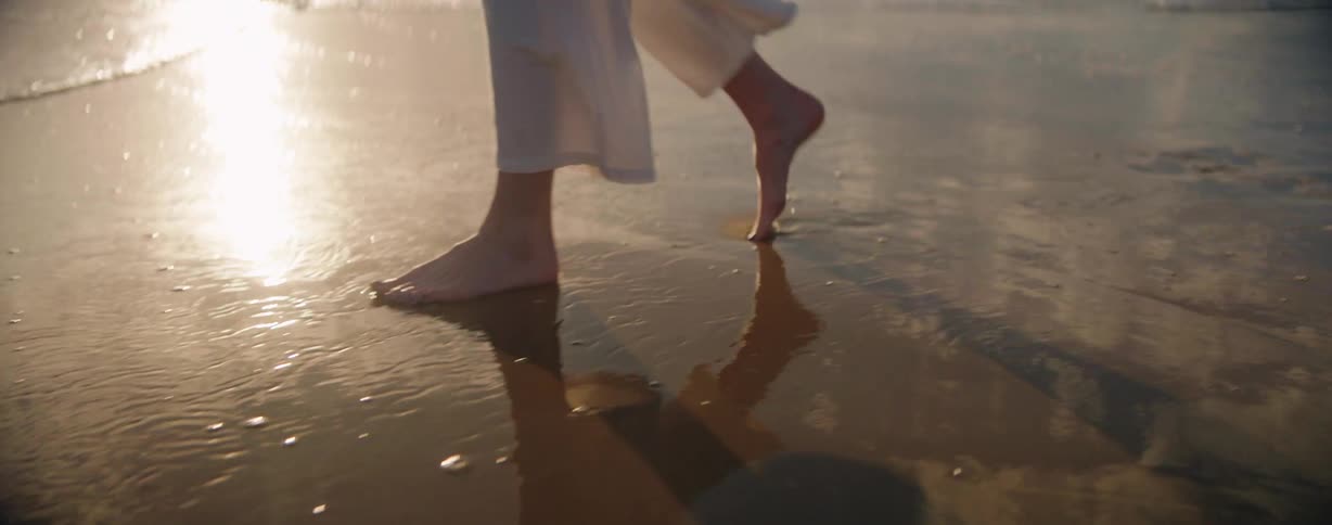 A person is walking on the beach