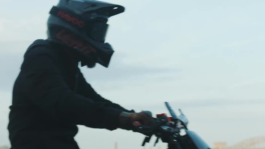 Person riding a motorcycle through the city