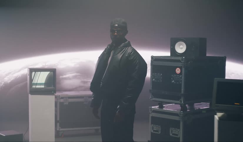 A man is posing on the studio stage