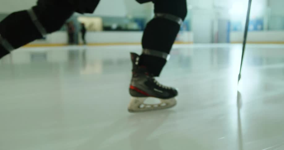 An ice hockey player skates on the ice