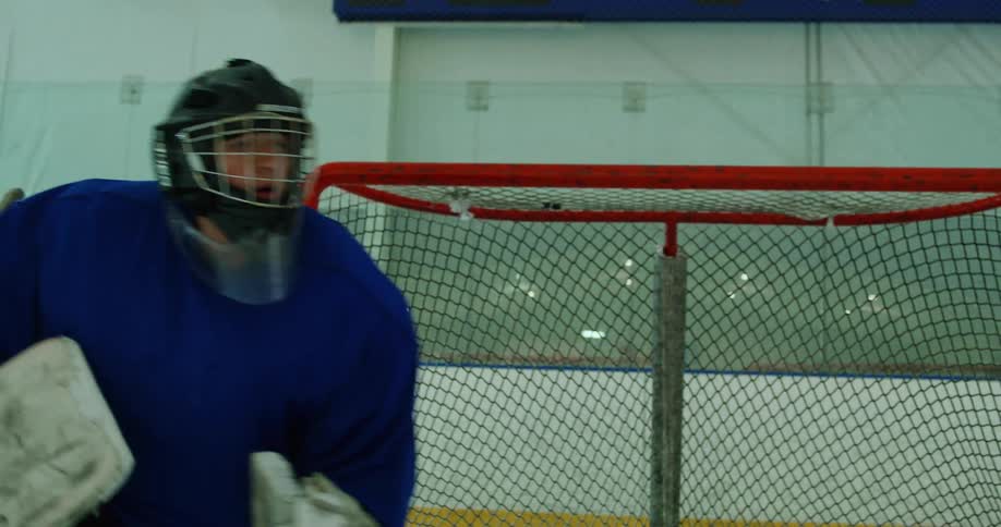 Man defending the goal on the court in hockey sport