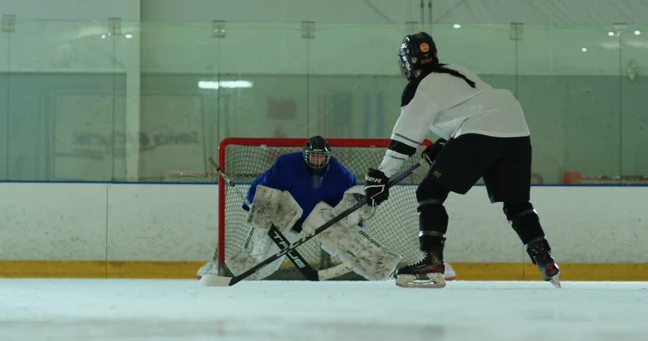 Player taking a shot on the goalkeeper during practice