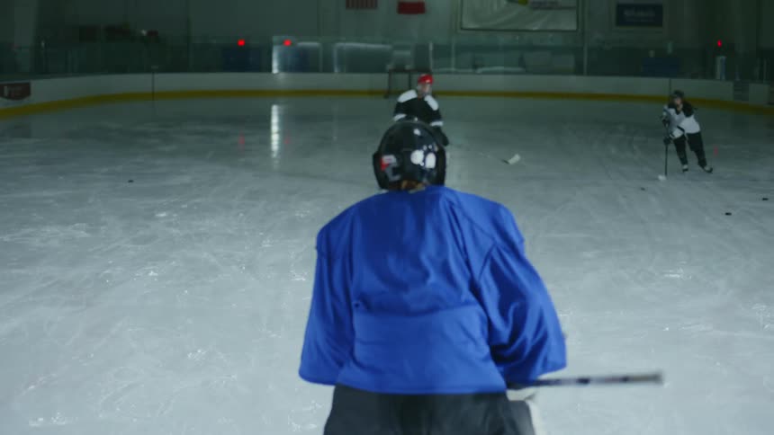 Hockey players compete on the ice