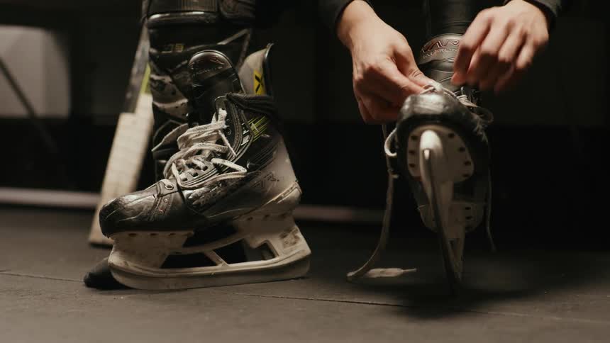 A clip of a person lacing their ice skates