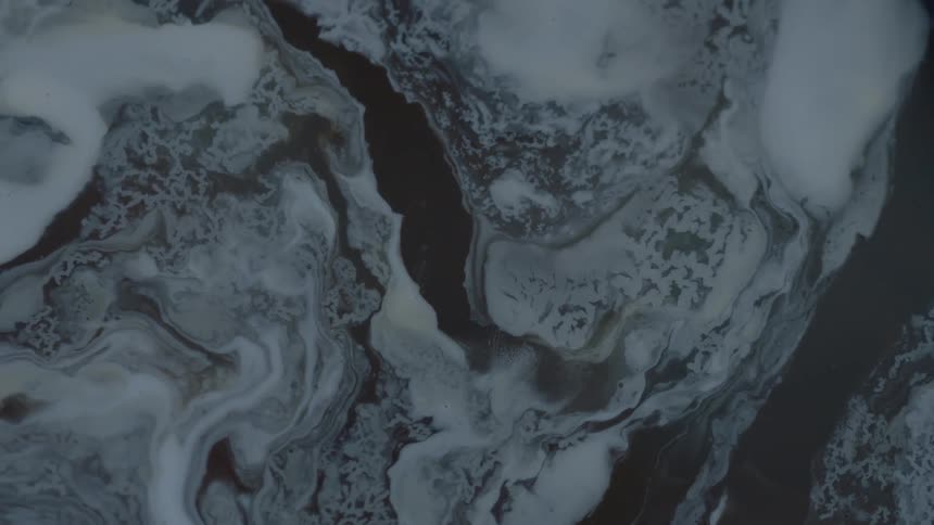 The white liquid is swirling in the water