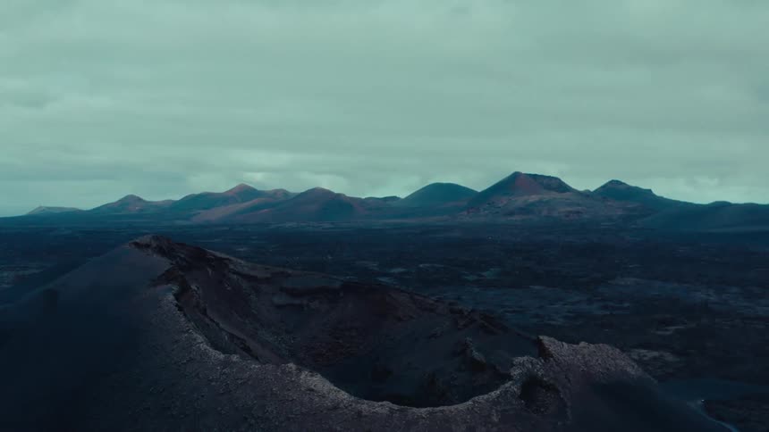 Aerial panorama of a crater on a mountain on a cloudy day