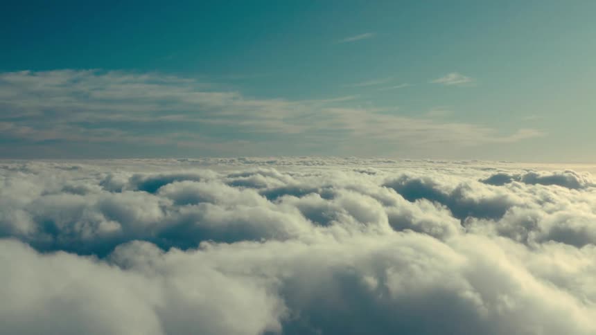Aerial view of puffy and white clouds floating