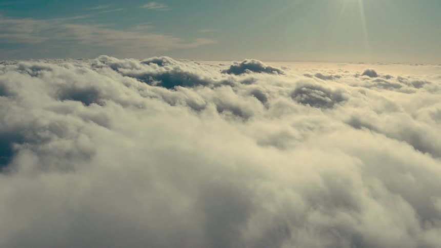 A cloudy sky bathed in the soft glow of the sun